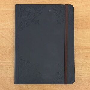 Small Black Notebook with Elastic Closure and Floral Engravement